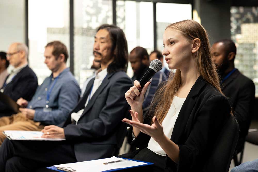 young woman journalist reading questions from clip